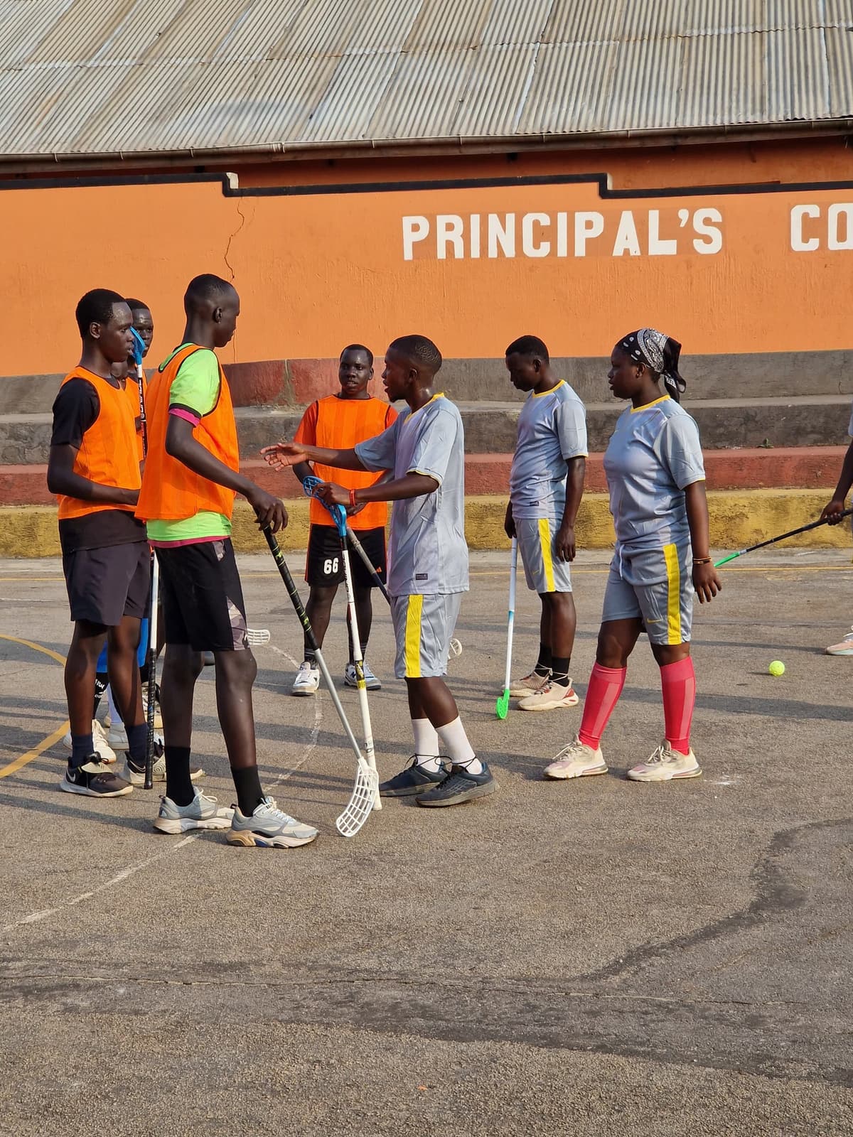 Players huddled before a floorball session